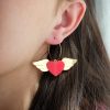 ergi-earrings-heart-with-wings-red-gold-on-ear Обеци Winged Hearts (Red-Gold)