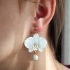 ergi-earrings-orchids-white-gold-on-ear Обеци Orchids White Marble and Gold