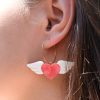 ergi-earrings-winged-hearts-pink-white-on-ear Обеци Winged Hearts (Pink-White)